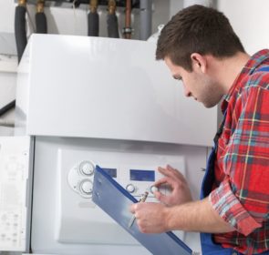 Technician servicing a boiler