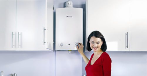 Woman using condensing boiler