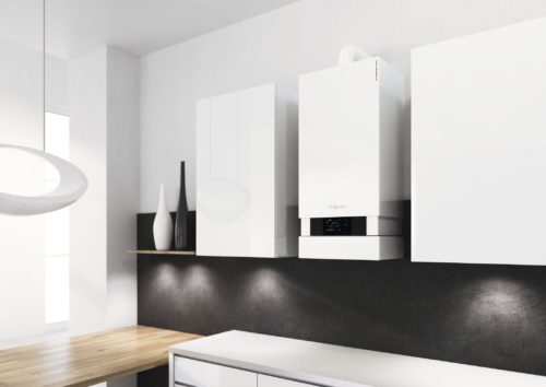 Boiler in modern kitchen; central heating installation cost