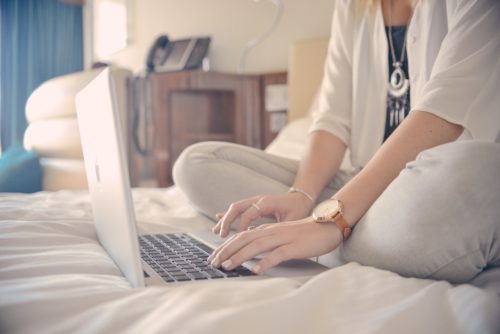 Woman looking for new boiler prices online