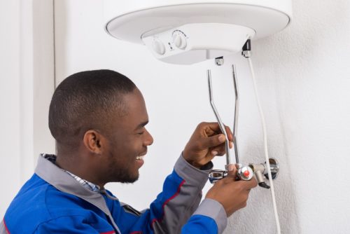 Engineer taking care of boiler; boiler service cost