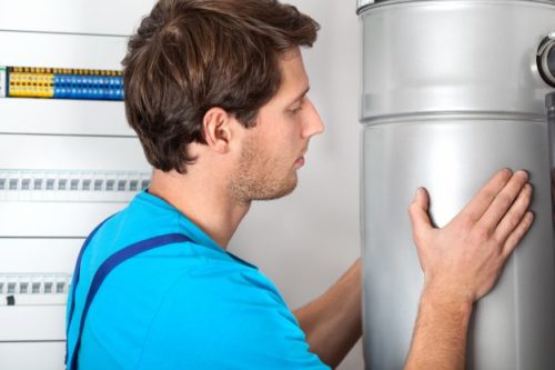 Heating engineer fitting in a boiler