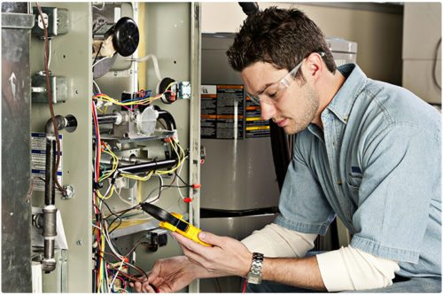 Heating professional servicing central heating systems